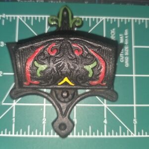 Decorative Black Wall Match Holder with Red and Green Accents